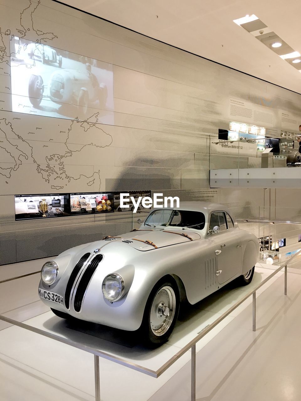 VINTAGE CAR ON FLOOR IN ILLUMINATED UNDERGROUND