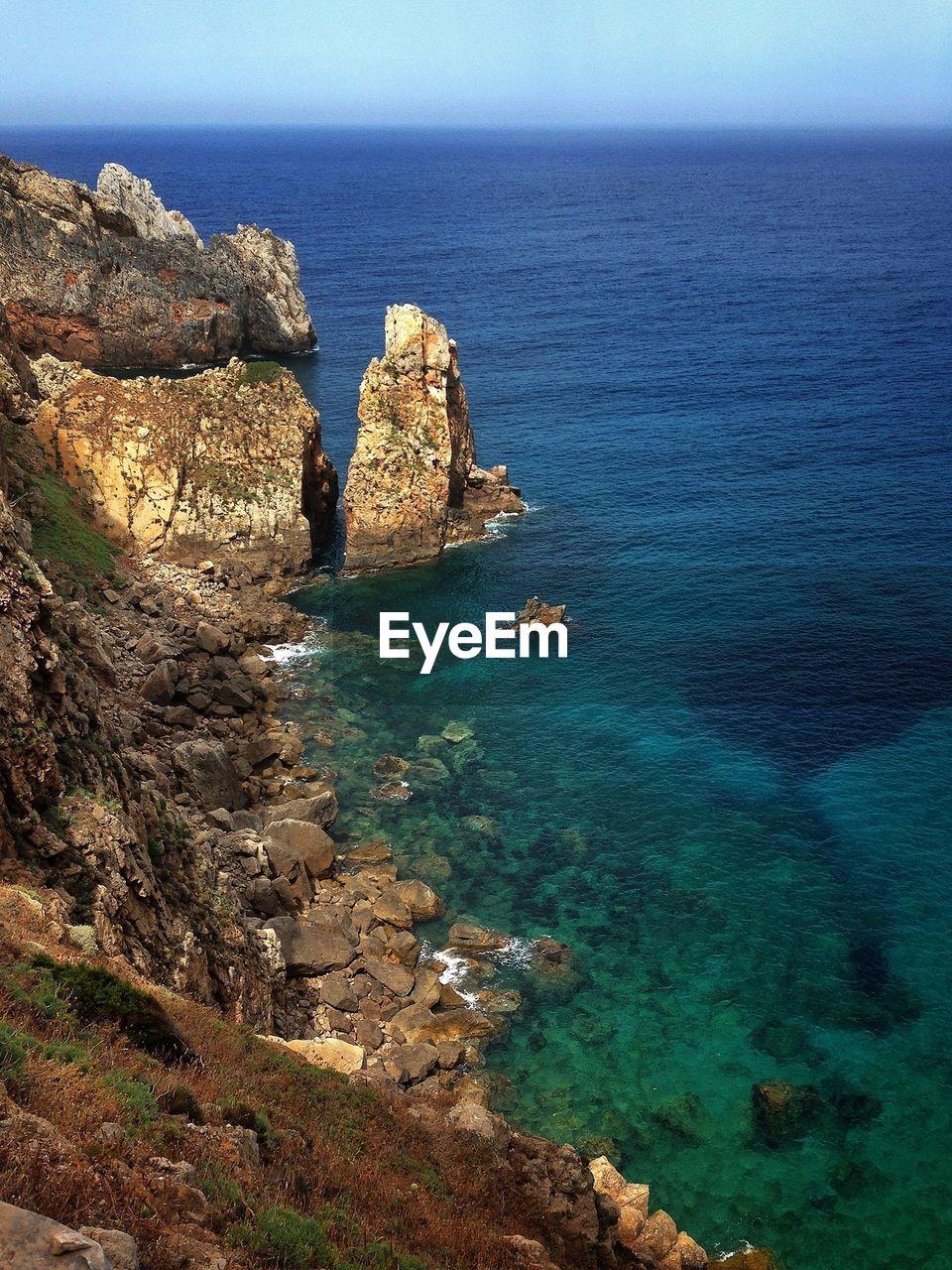 Scenic view of sea against blue sky