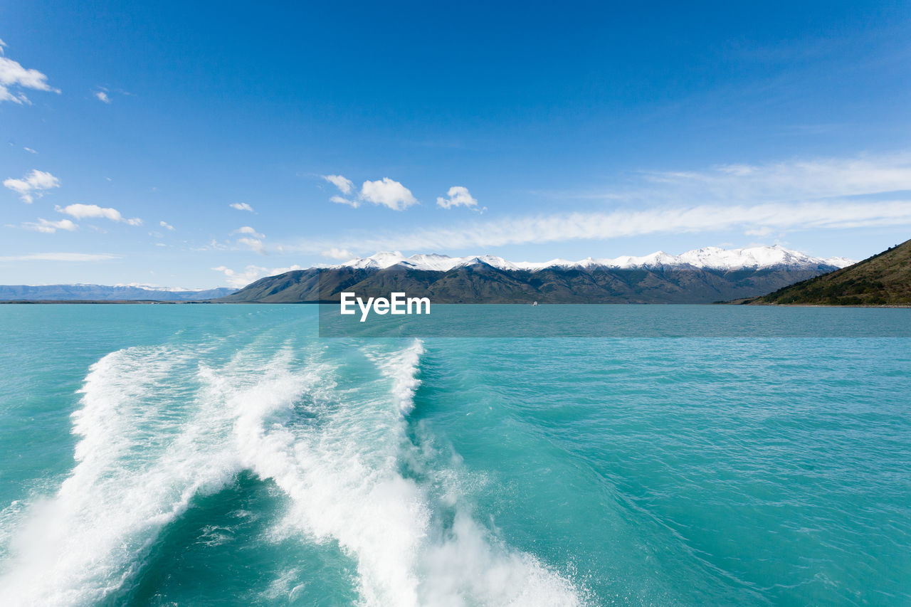 Scenic view of sea against blue sky