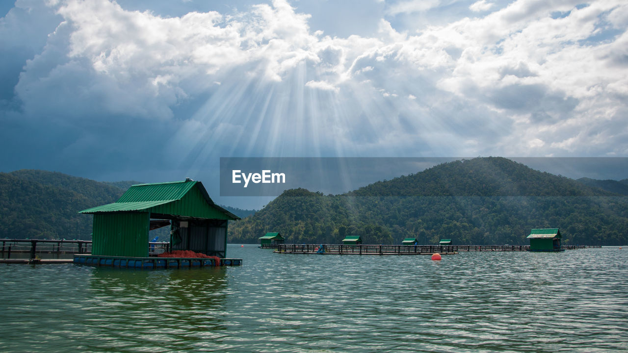 Floating houses on scenic mountain lake