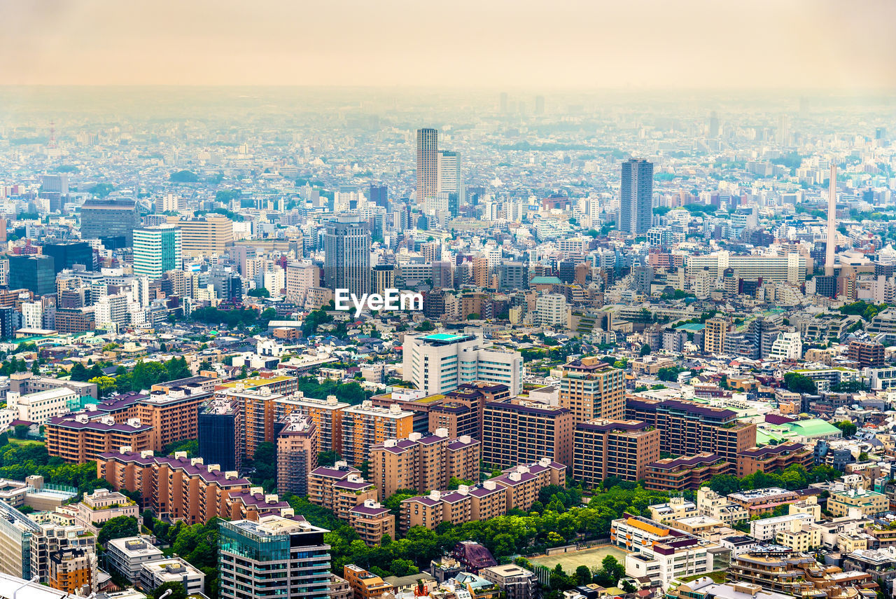 HIGH ANGLE VIEW OF CITY BUILDINGS AGAINST SKY