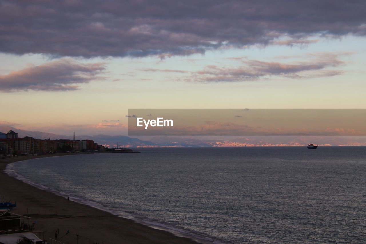 Scenic view of sea against sky at sunset