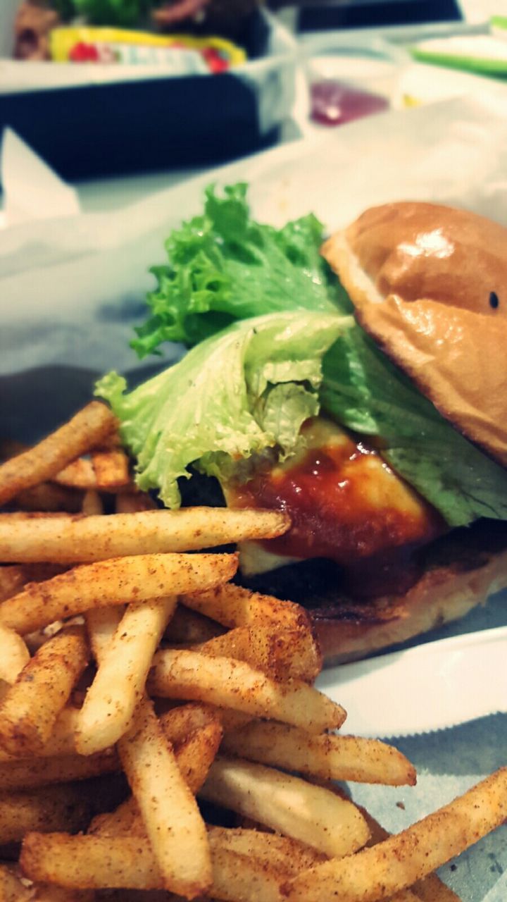 Close-up of hamburger with french fries