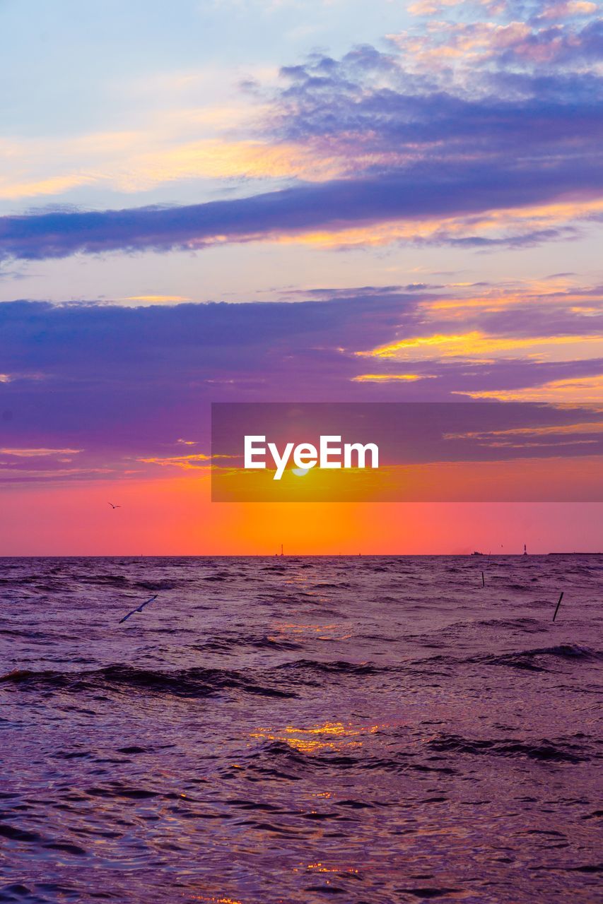 SCENIC VIEW OF SEA DURING SUNSET