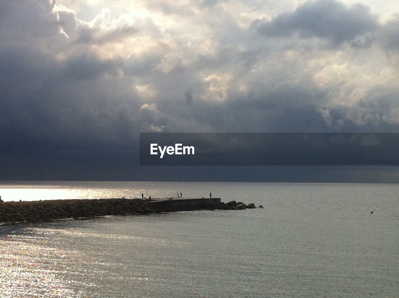 VIEW OF SEA AGAINST CLOUDY SKY