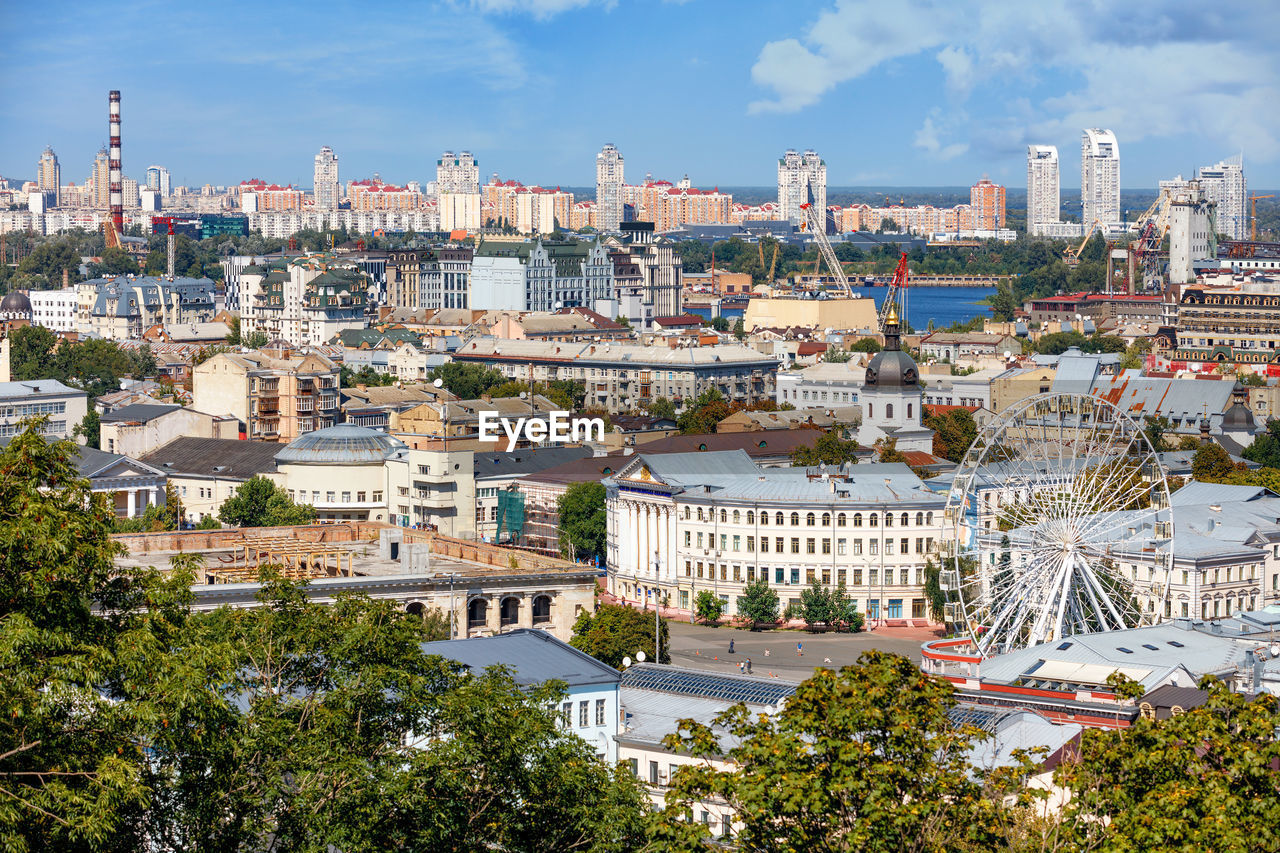 HIGH ANGLE VIEW OF BUILDINGS AGAINST SKY