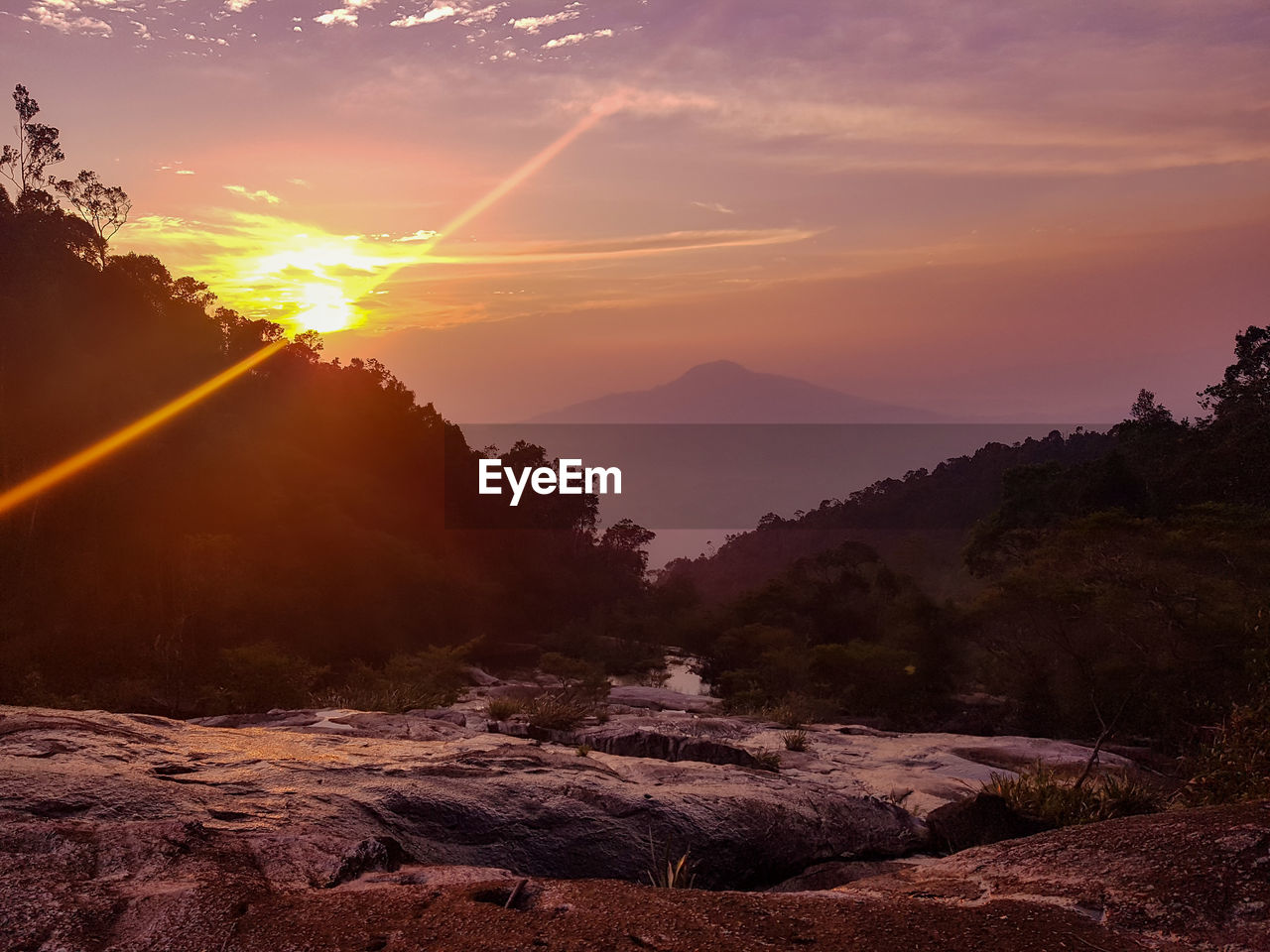 Scenic view of mountains against sky during sunset