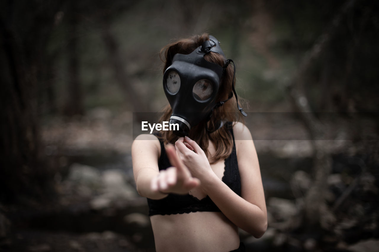 Woman wearing gas mask