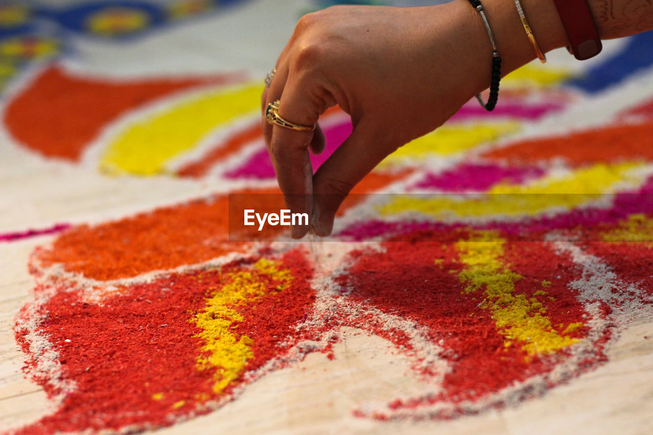 Close-up of hand making mandala