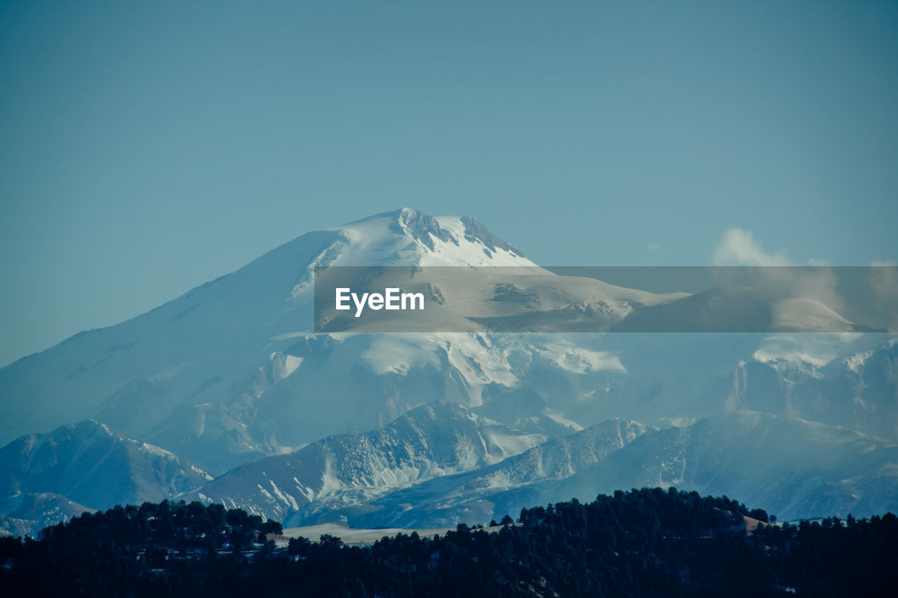 MAJESTIC SNOWCAPPED MOUNTAINS AGAINST SKY