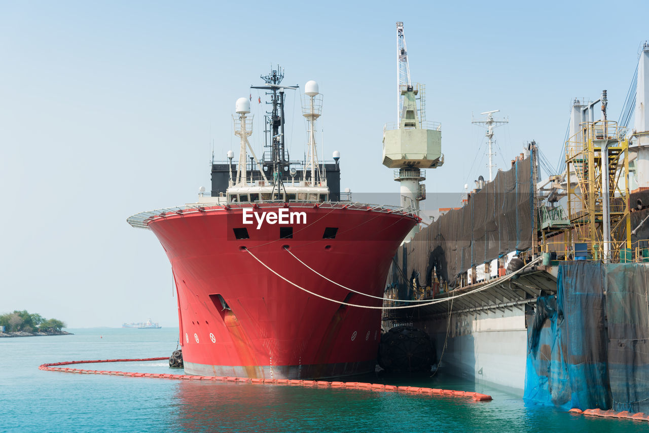 COMMERCIAL DOCK AGAINST CLEAR SKY