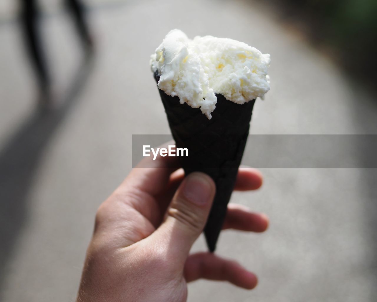 Close-up of hand holding ice cream