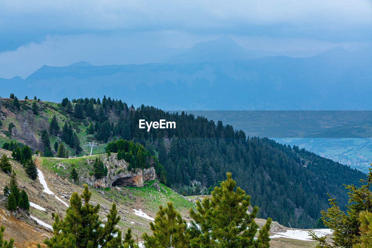 High angle view of trees and mountains against sky