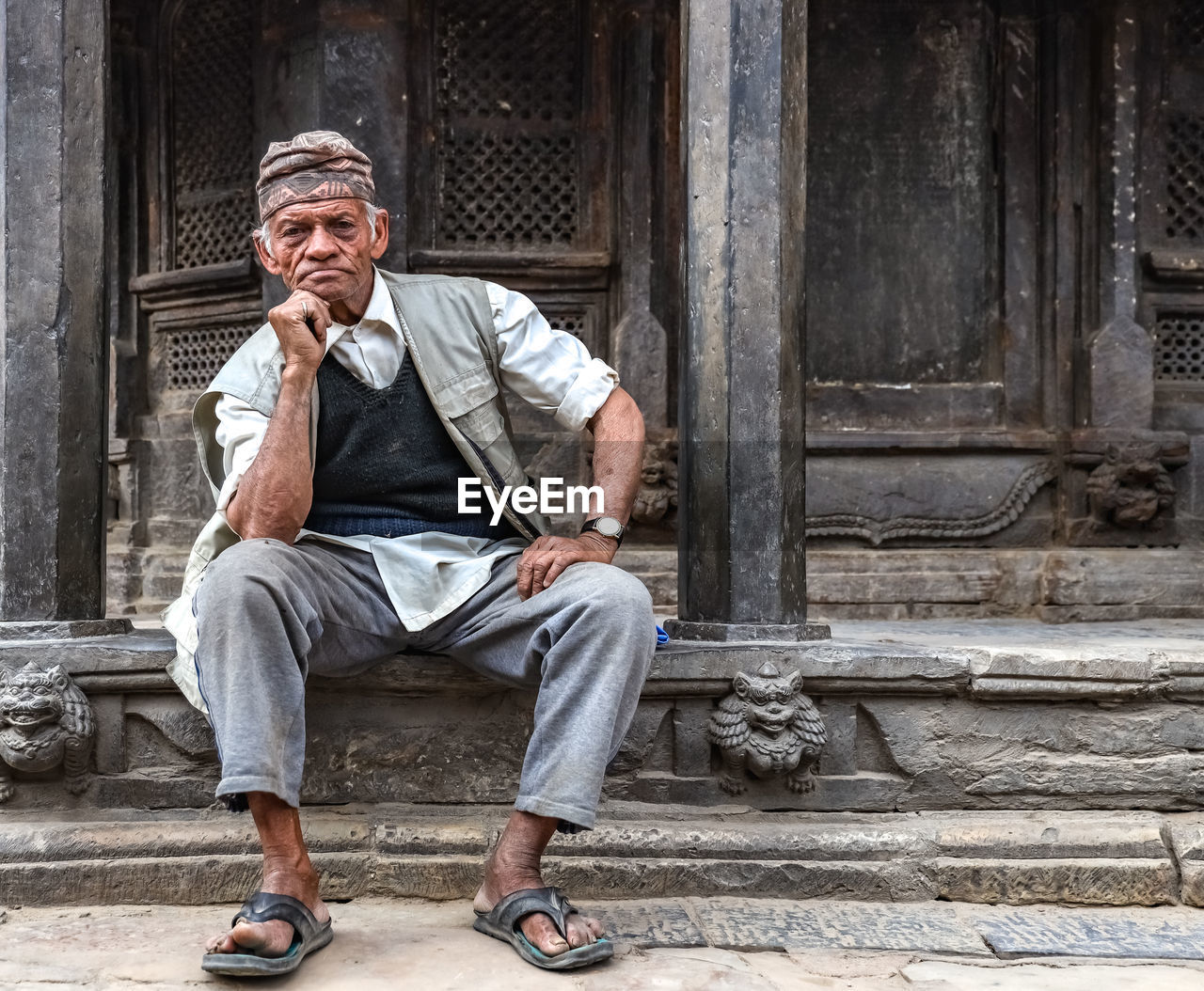 Portrait of senior man sitting outdoors