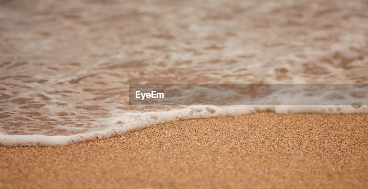 Close-up of sand at beach