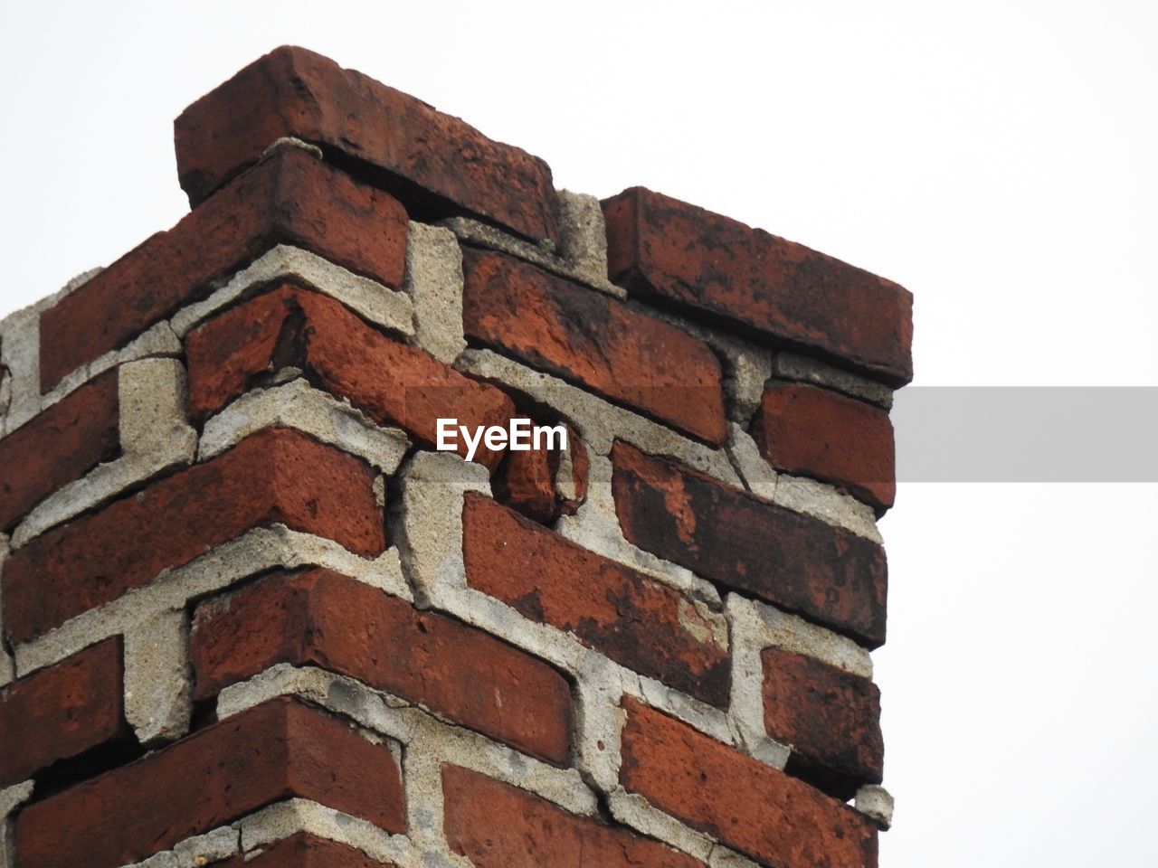 Low angle view of chimney in disrepair