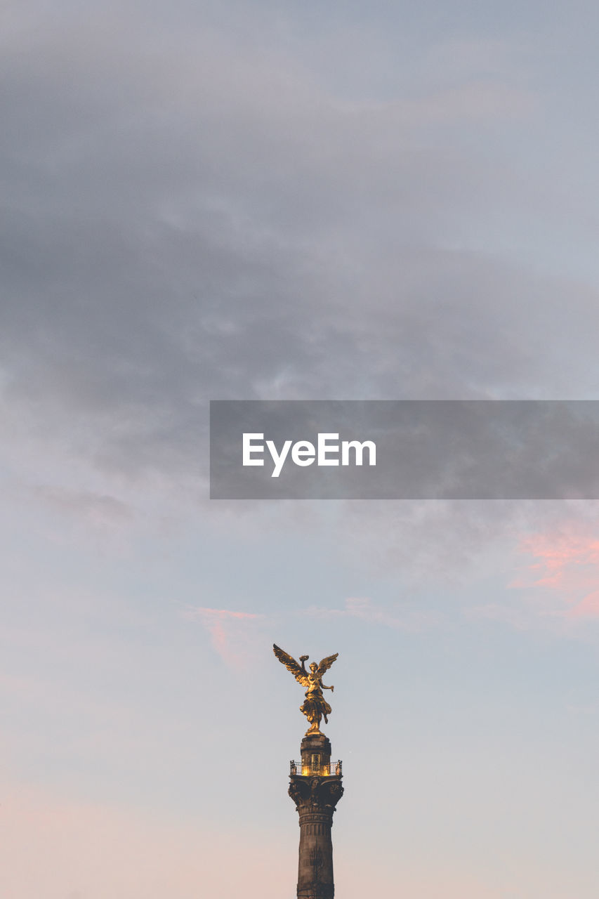 Low angle view of independence monument against sky during sunset