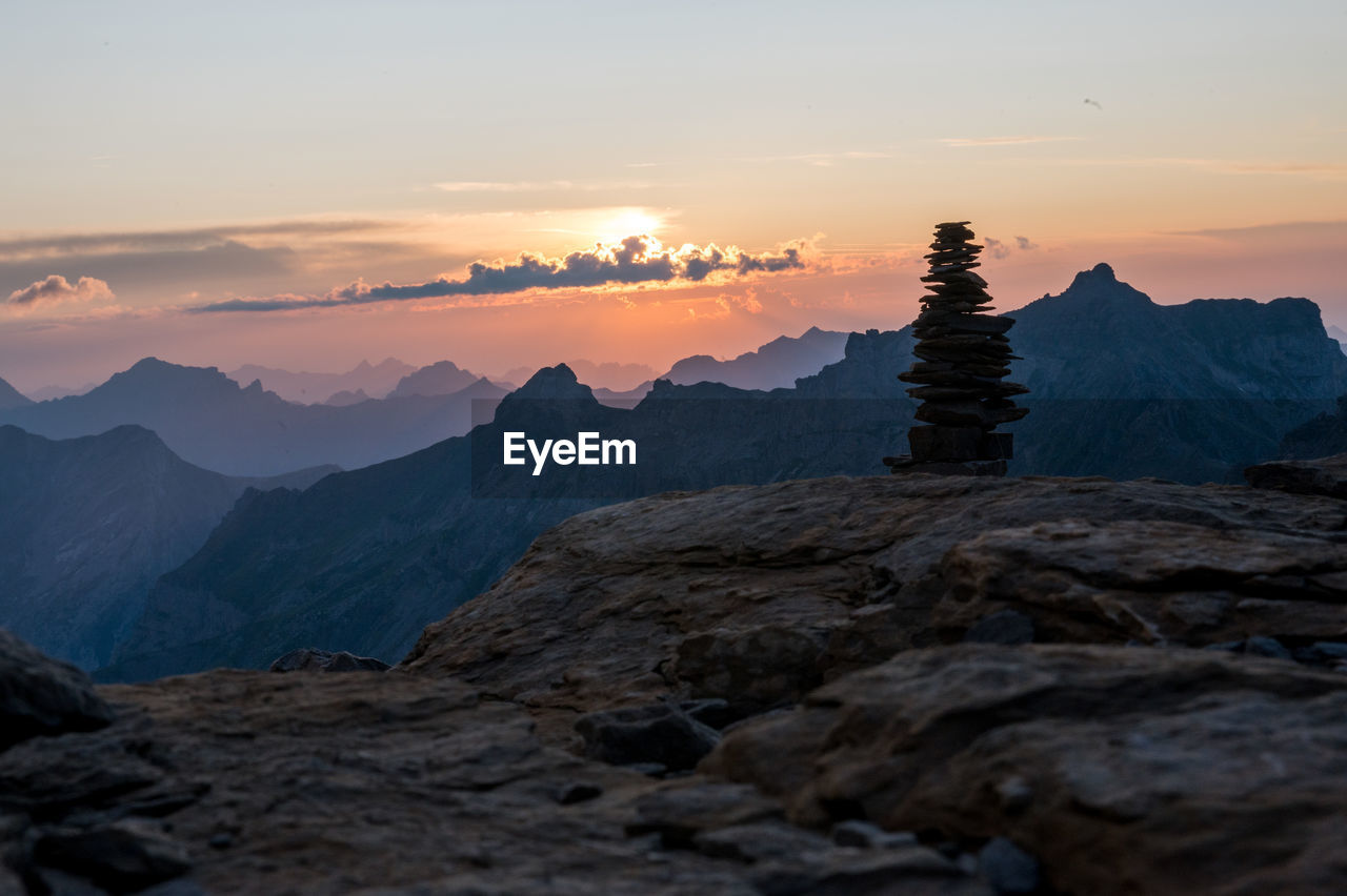 SCENIC VIEW OF MOUNTAINS DURING SUNSET