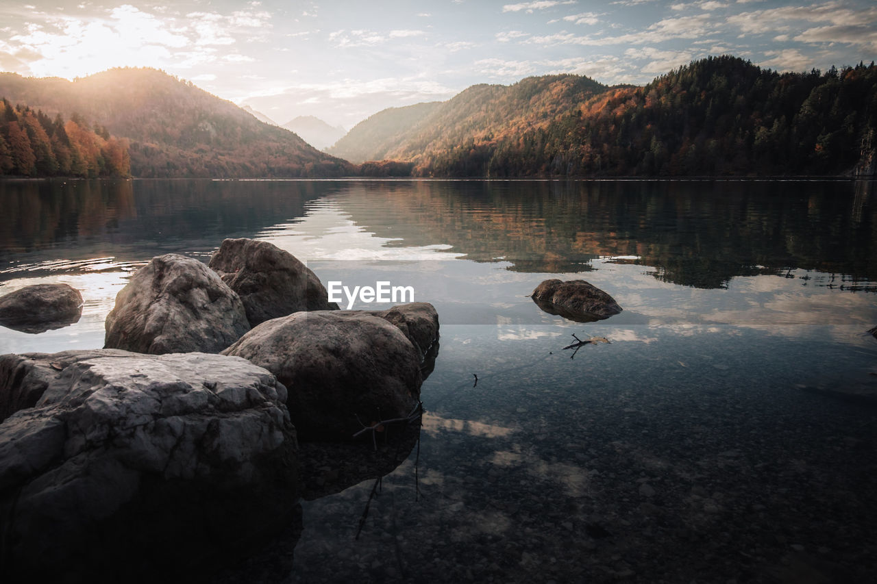 SCENIC VIEW OF LAKE AND ROCKS AGAINST SKY