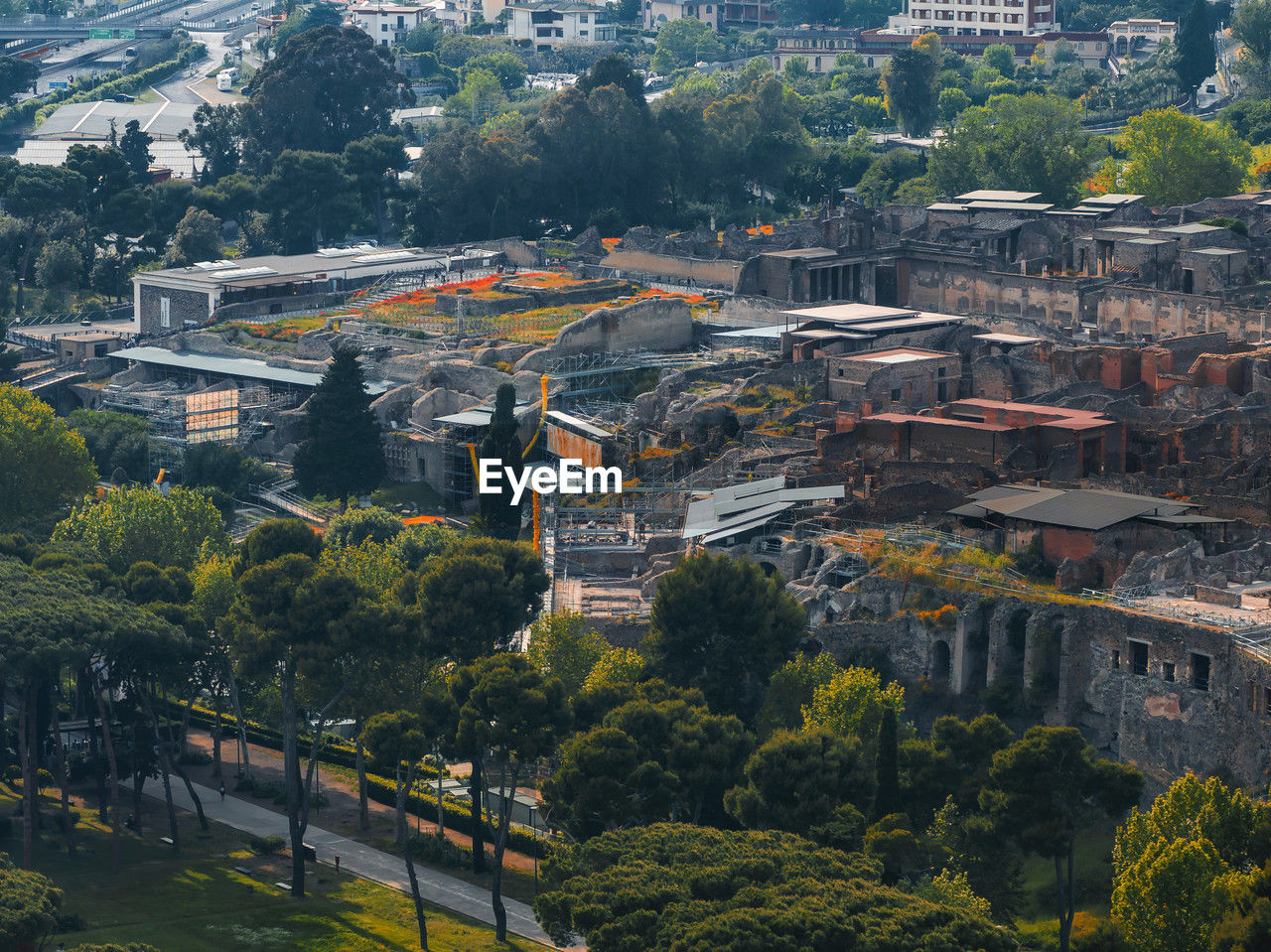 architecture, aerial photography, built structure, cityscape, building exterior, city, tree, town, high angle view, building, plant, nature, urban area, bird's-eye view, landmark, residential district, landscape, no people, outdoors, skyline, travel destinations, travel, environment, day, transportation, house, aerial view, history, street, land, residential area, the past