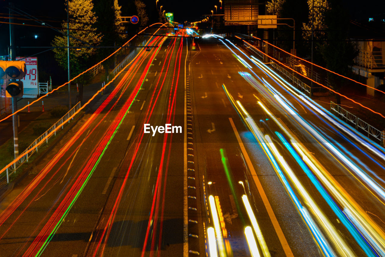 High angle view of light trails on road at night