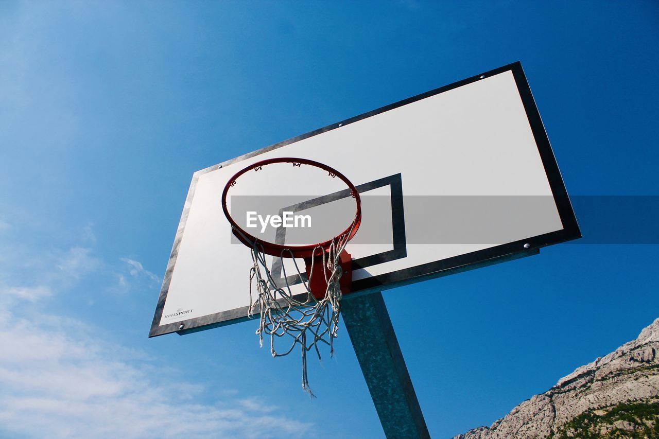 Low angle view of basketball hoop against sky