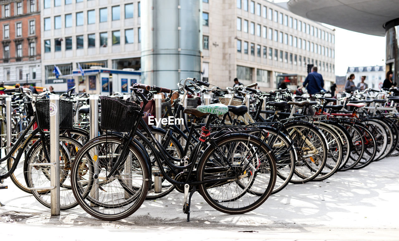 Bicycles parked against buildings in city