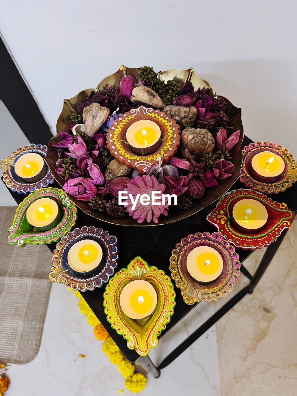 yellow, flower, food, food and drink, high angle view, freshness, indoors, no people, table, circle, still life, healthy eating, sweet food, flowering plant, purple, plate, decoration, arrangement, directly above