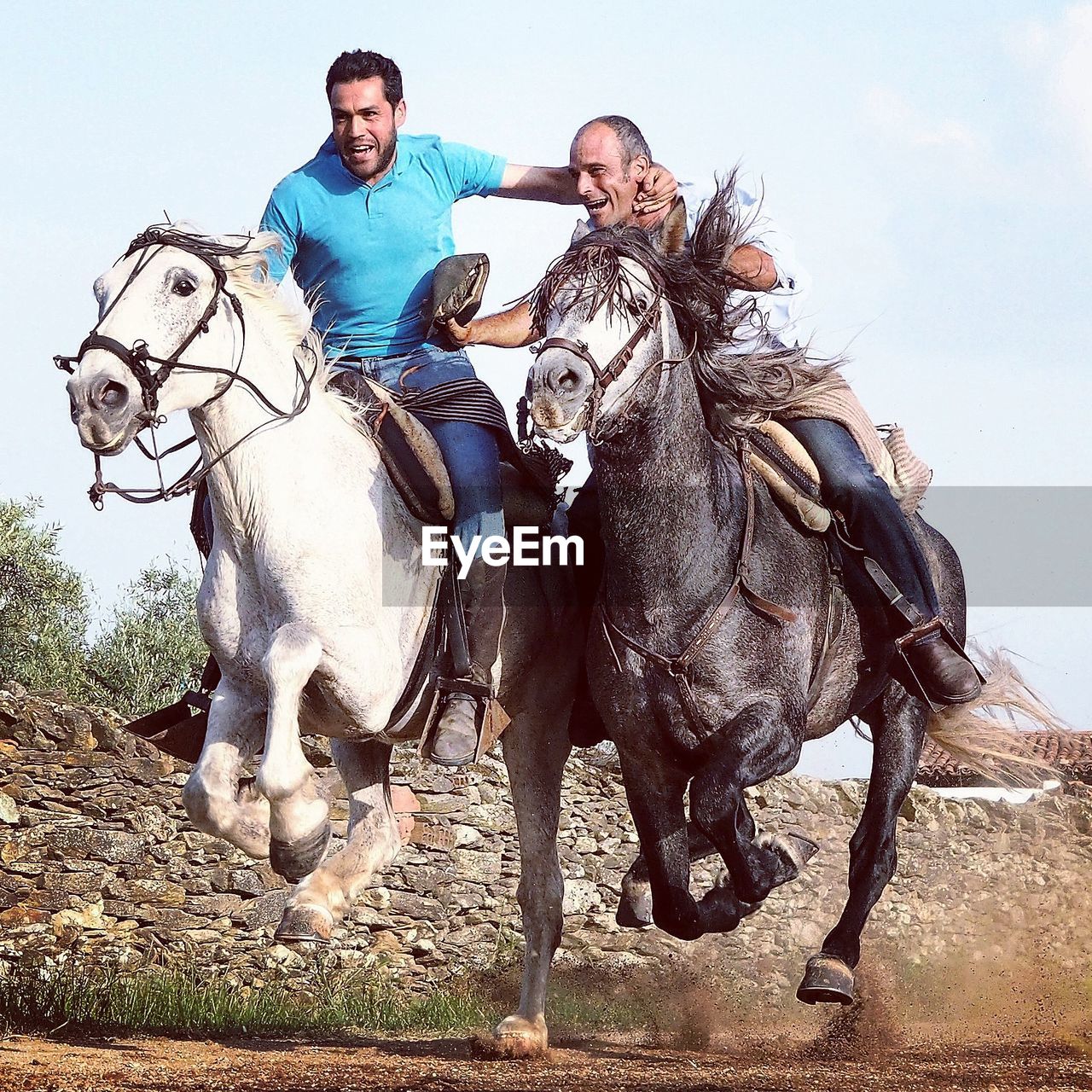 FULL LENGTH OF HAPPY MAN RIDING HORSE