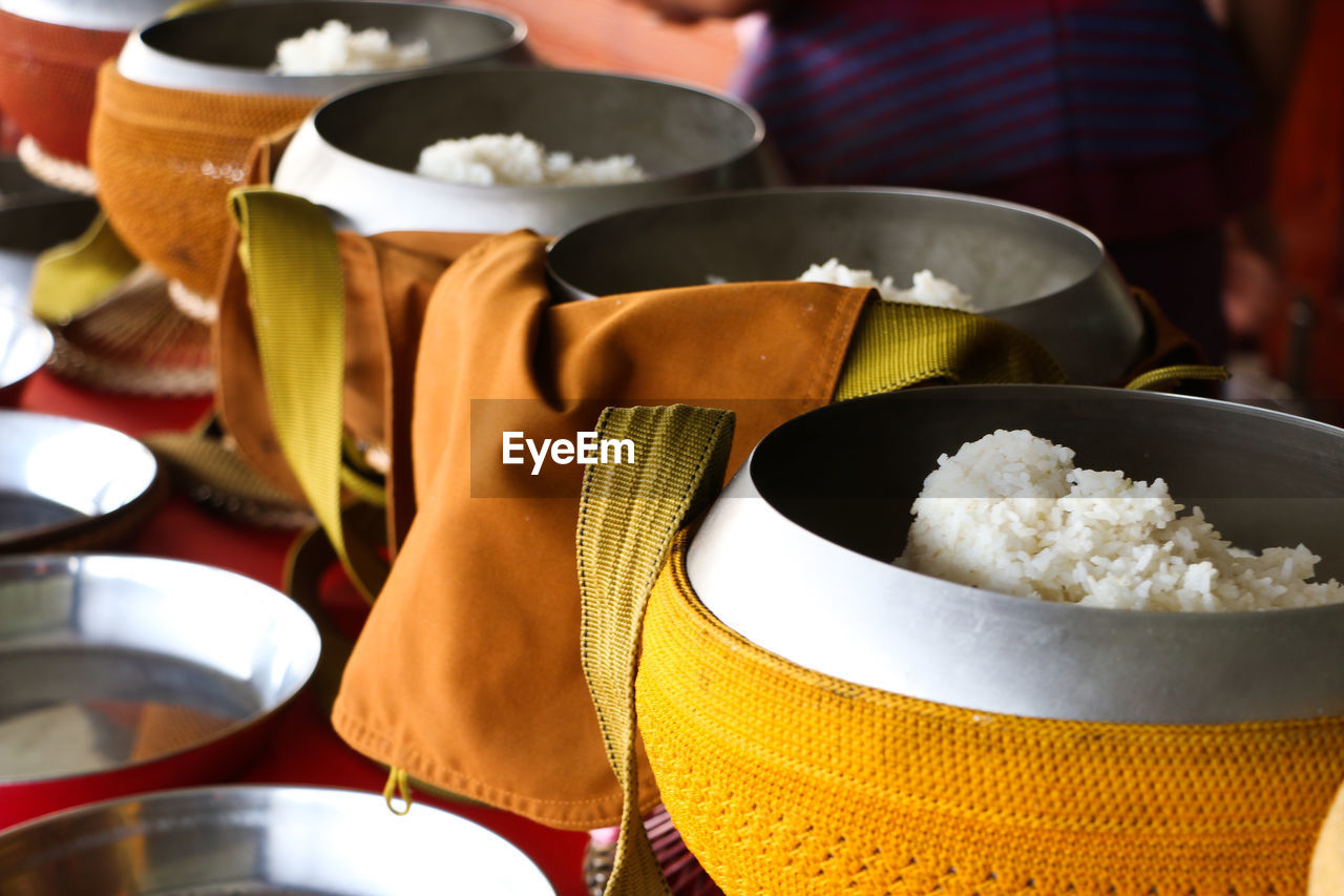 Close-up of rice in alms bowl of monk