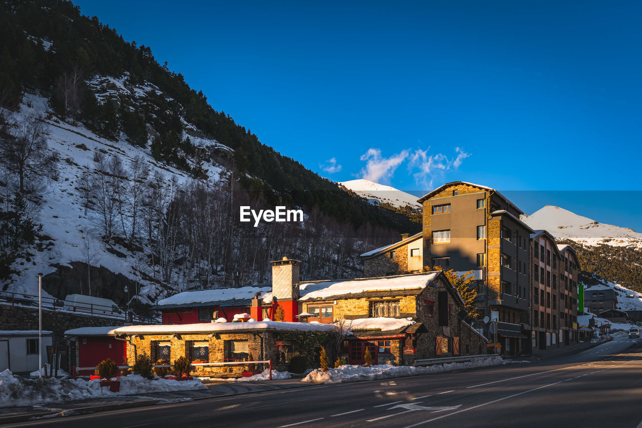 Sunset light illuminating bars, restaurants and residential building in el tarter and soldeu andorra