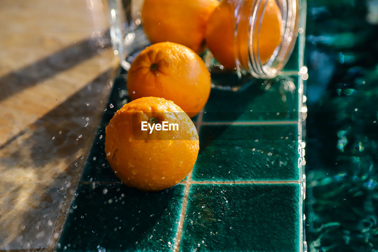 High angle view of orange fruit in water