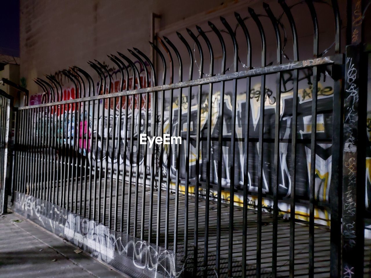 CLOSE-UP OF RAILING AND BUILDING