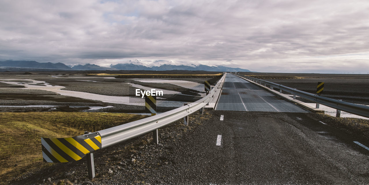 ROAD LEADING TOWARDS MOUNTAINS