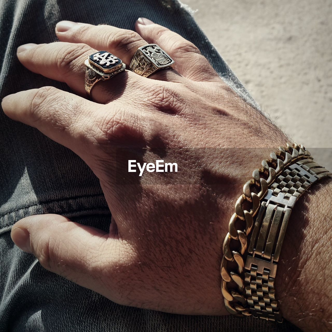 Cropped image of man hand wearing jewelry