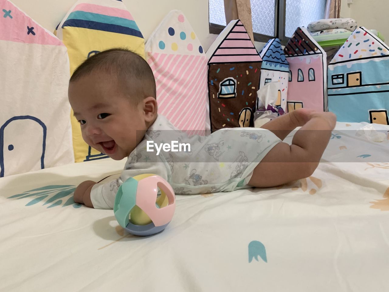 CUTE BOY LYING DOWN ON BED