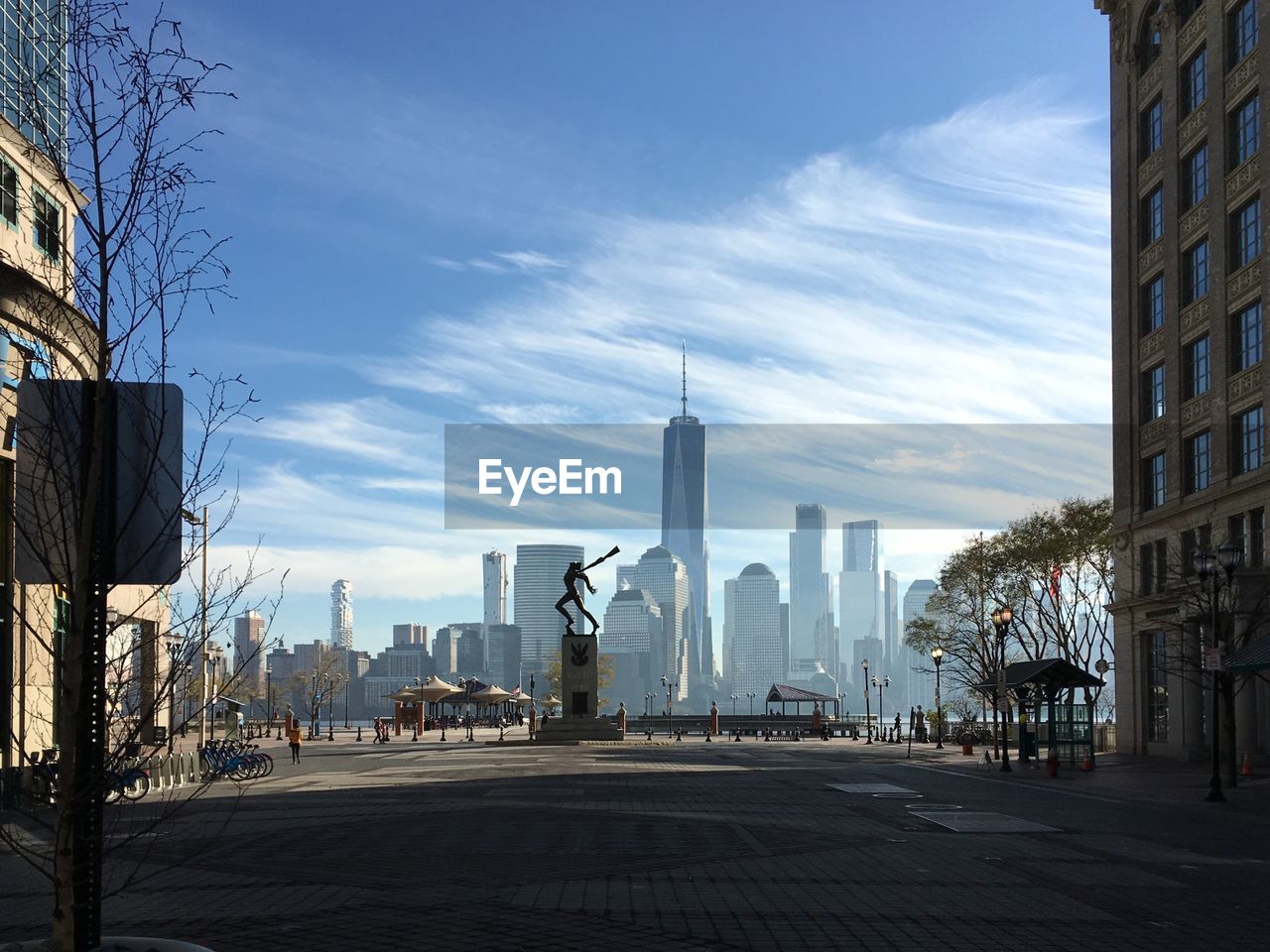 City street with modern buildings in background against sky