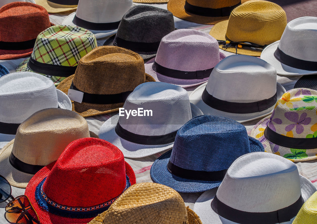 High angle view of multi colored hats at market