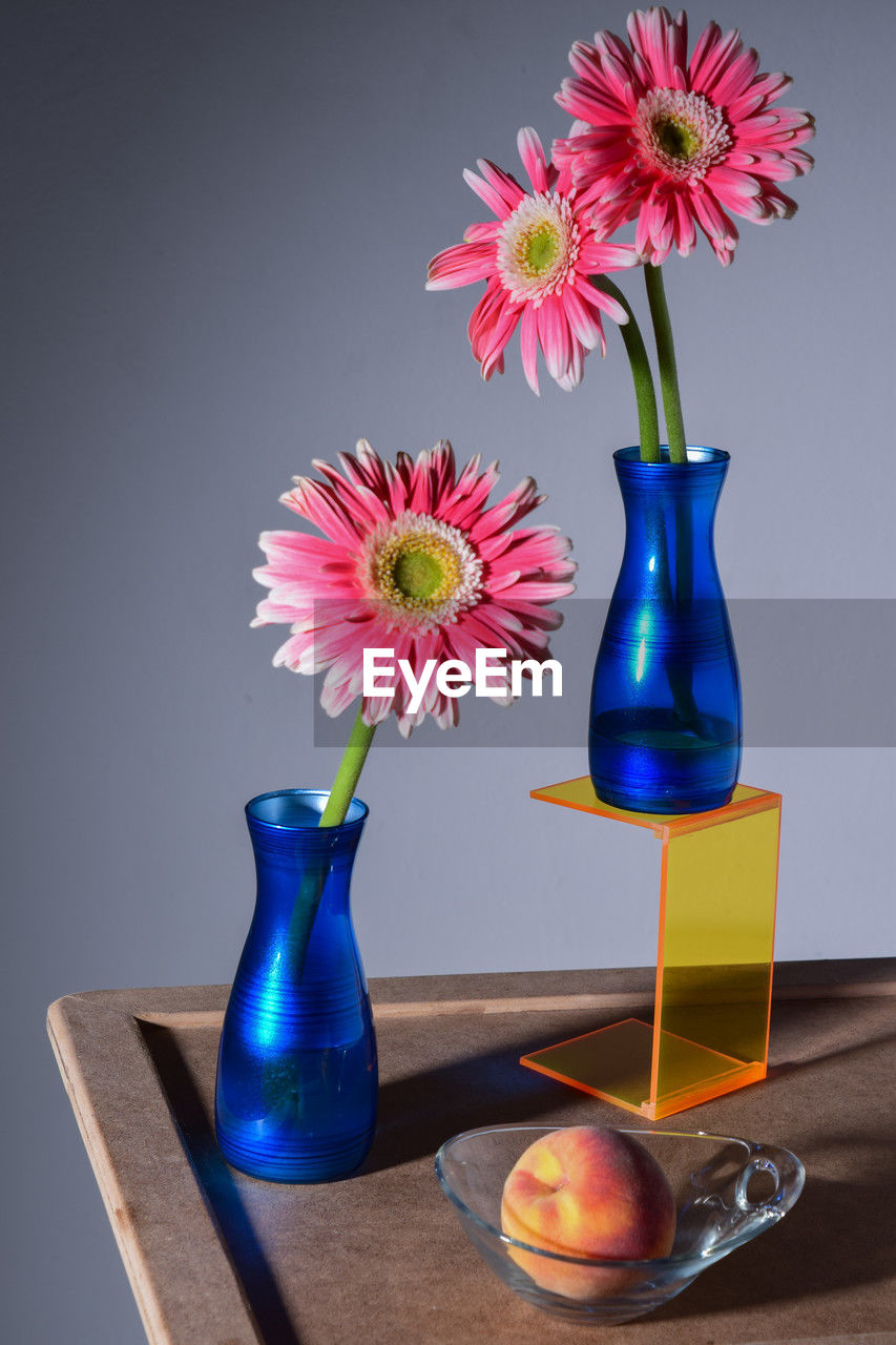 close-up of vase on table against white background