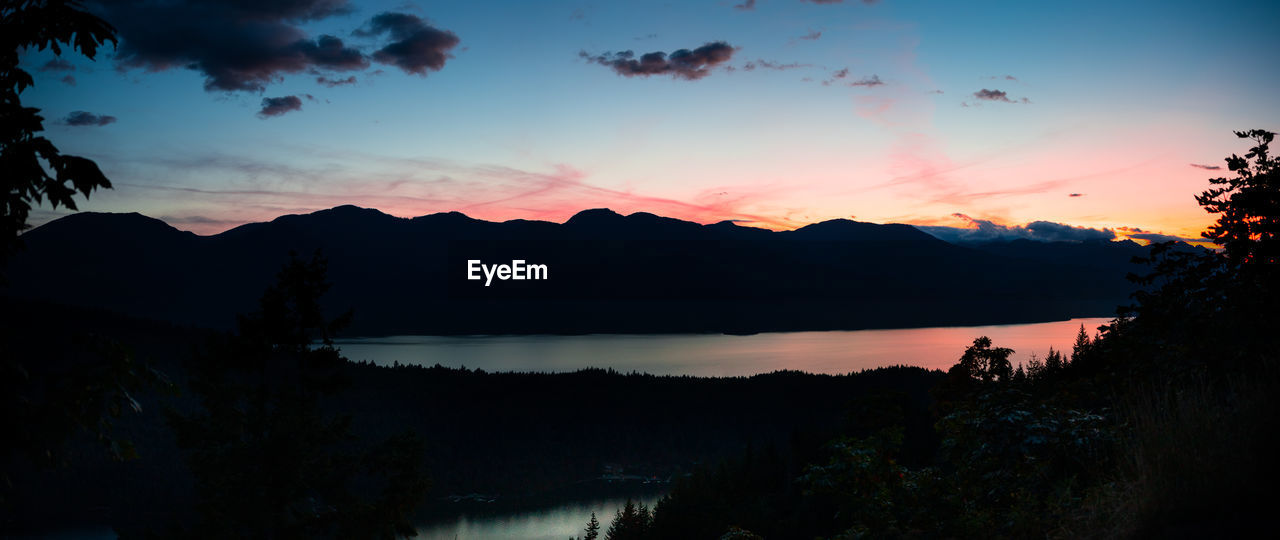 Panorama of mountains, lake and islands during sunset
