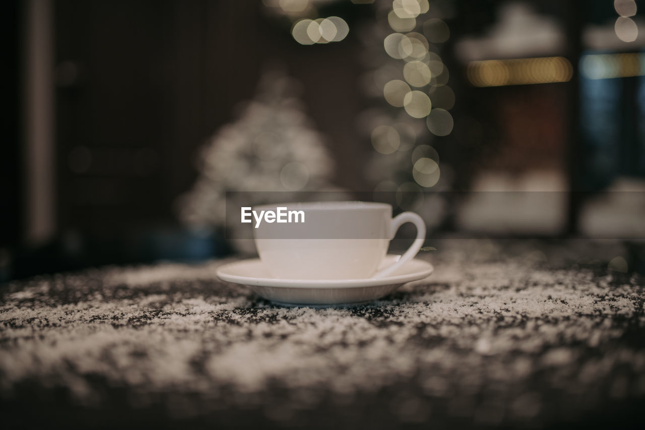 Close-up of coffee cup on table