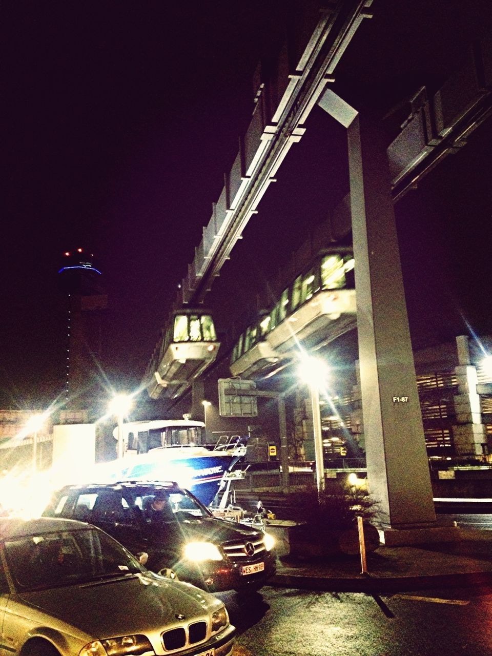 VIEW OF ILLUMINATED STREET LIGHTS AT NIGHT