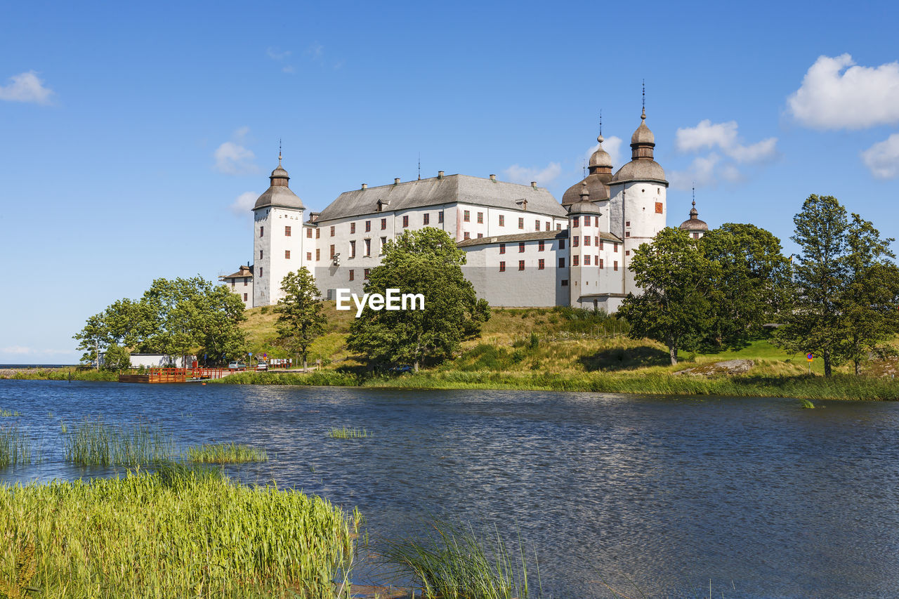 Beautiful läckö castle on a hill by a lake