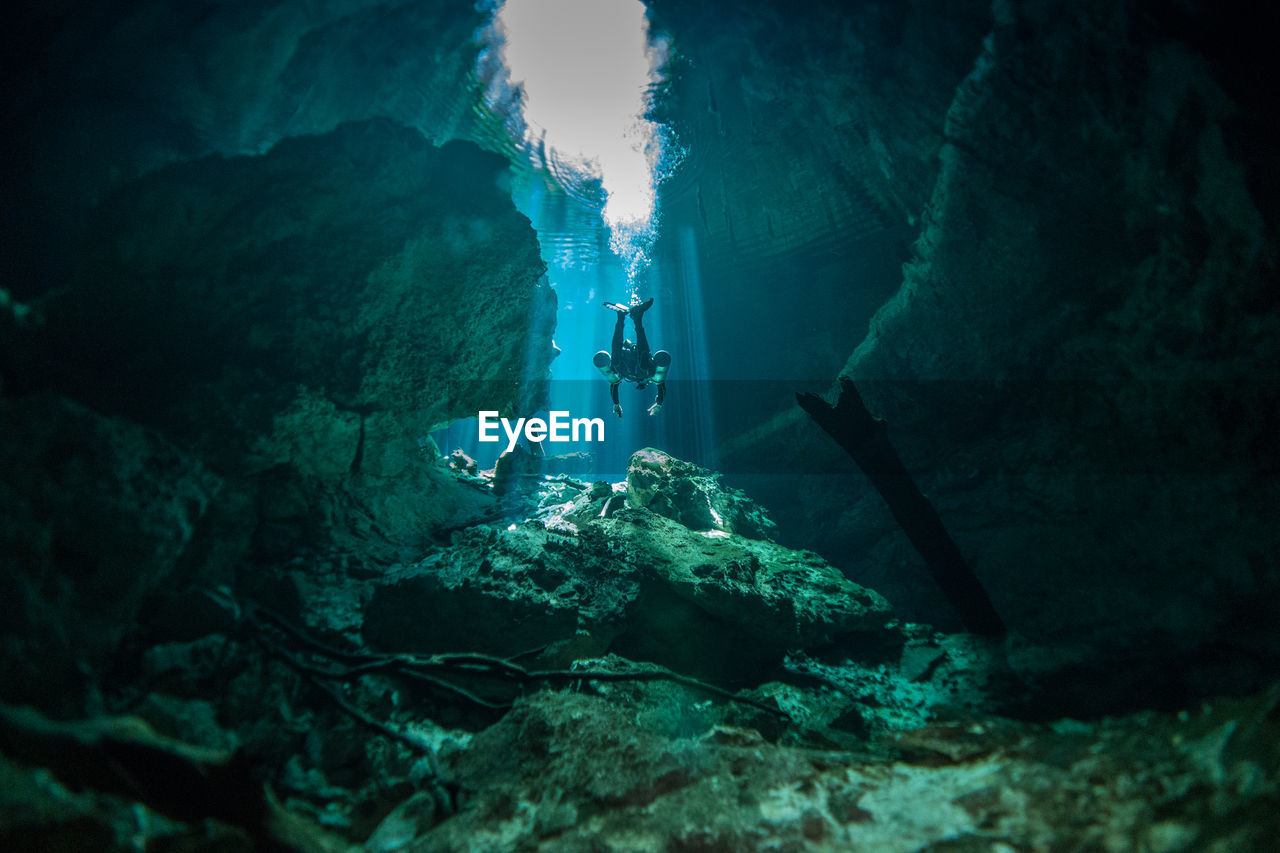 ROCK FORMATION IN SEA AGAINST CAVE