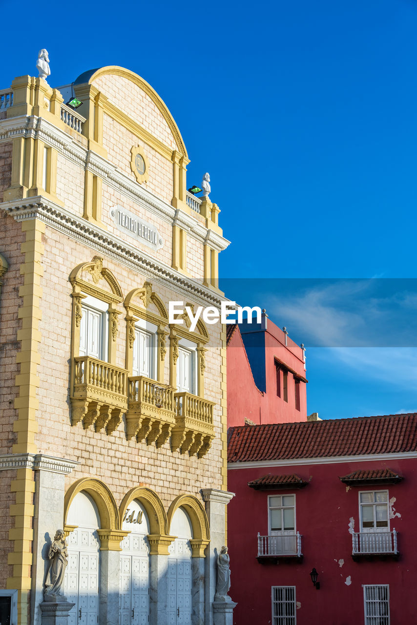 Low angle view of historic teatro heredia against sky