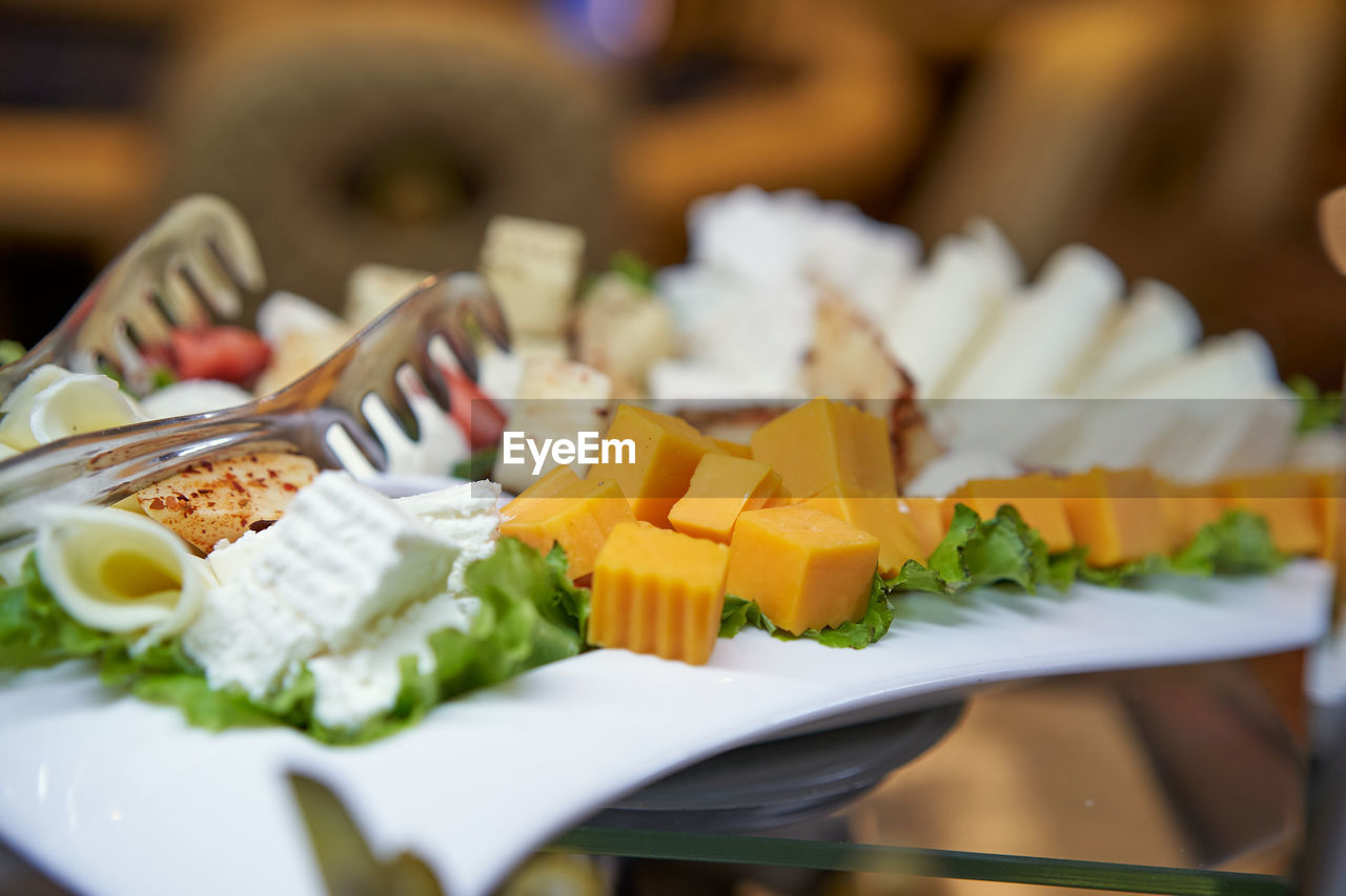 food and drink, food, healthy eating, meal, freshness, wellbeing, brunch, vegetable, lunch, plate, dish, selective focus, business, salad, fruit, restaurant, gourmet, breakfast, no people, cuisine, table, indoors, cheese, appetizer, dairy, variation, buffet, eating utensil, produce, close-up, seafood, crockery