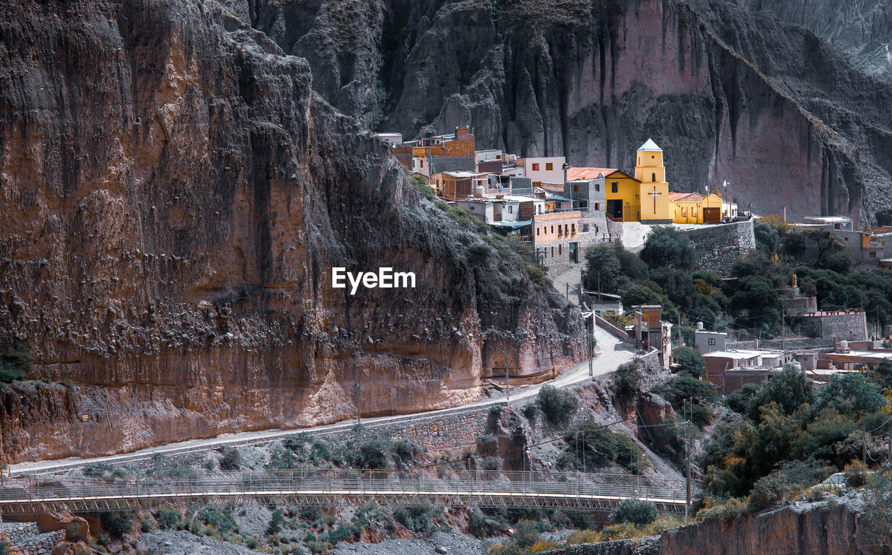 VIEW OF BUILDINGS ON MOUNTAIN