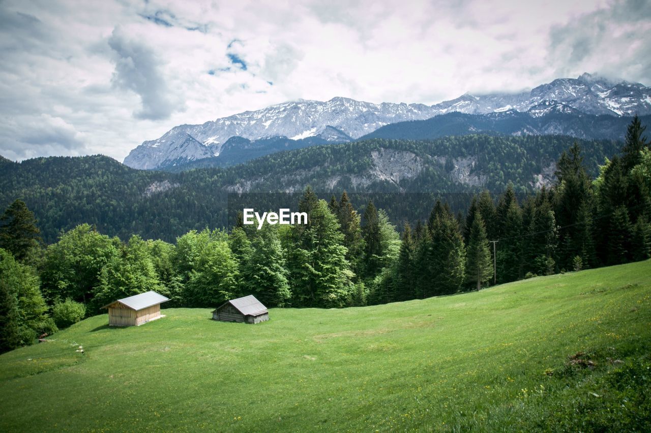 Scenic view of landscape and mountains against sky