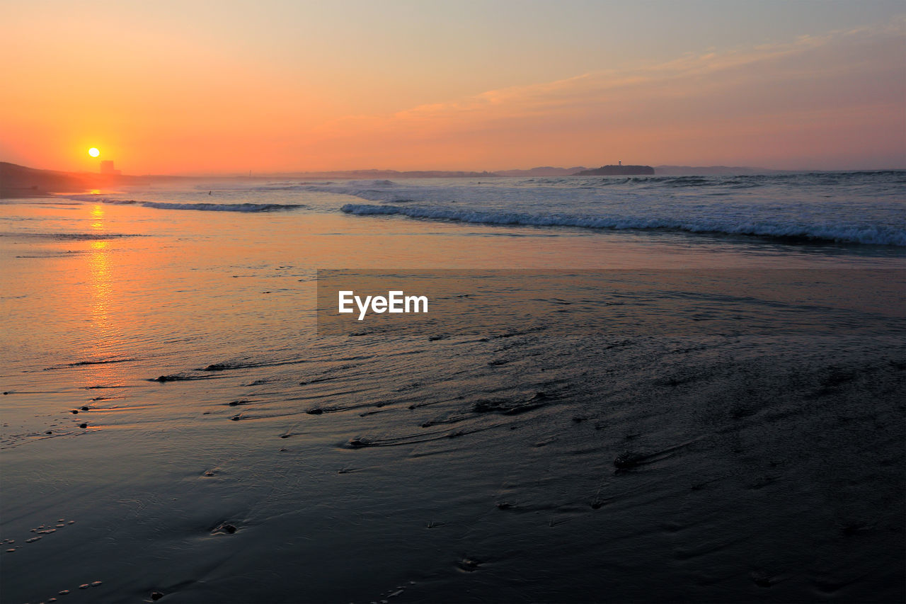 Scenic view of sea against sky during sunset