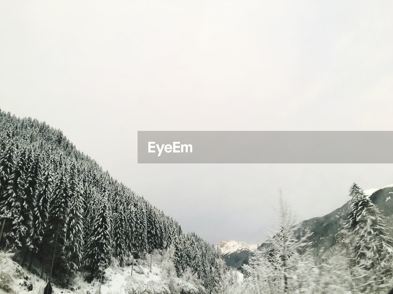 SNOW COVERED LANDSCAPE AGAINST SKY